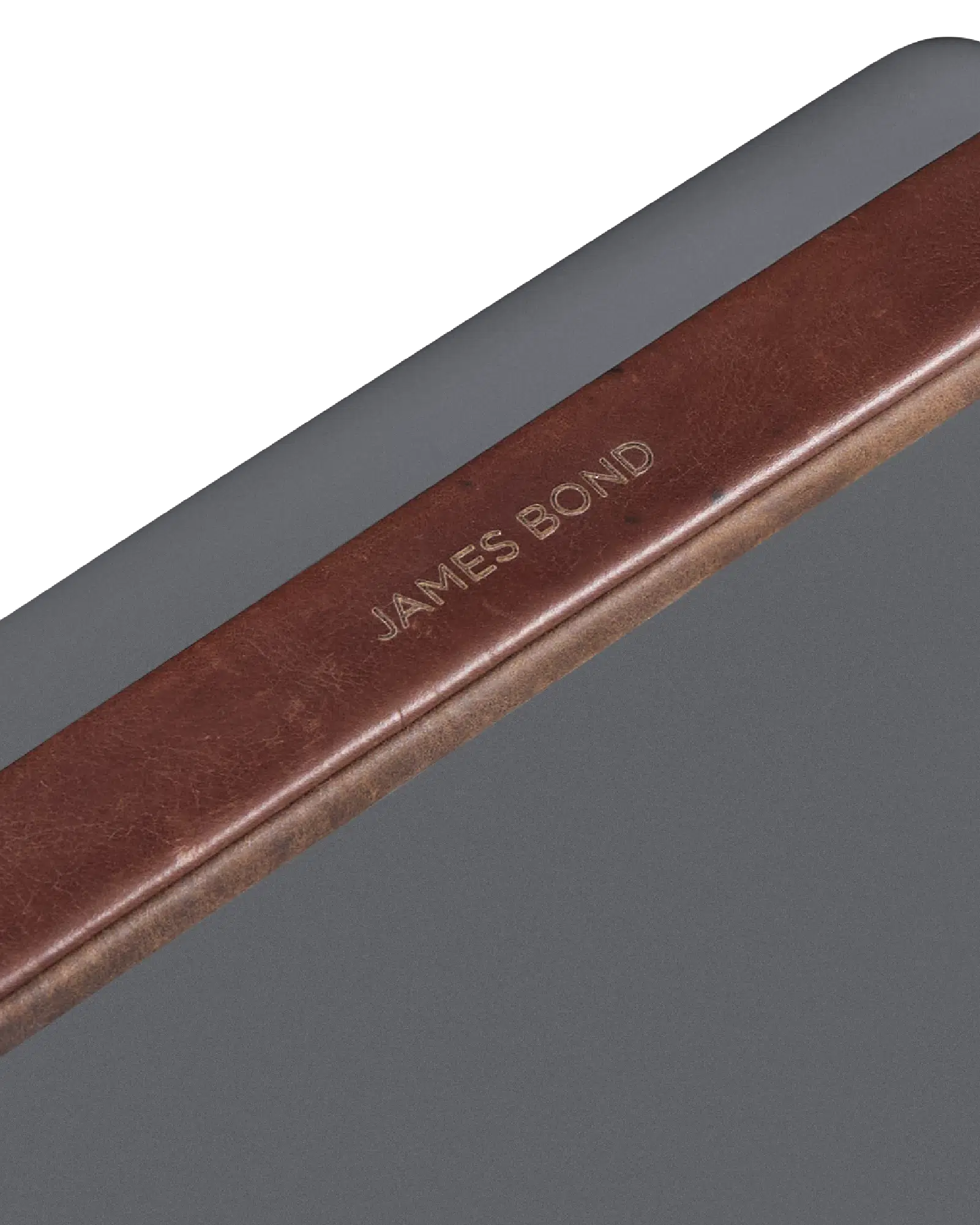 Close-up of a brown leather-bound book with 'James Bond' embossed on it for fieldbar personalised items